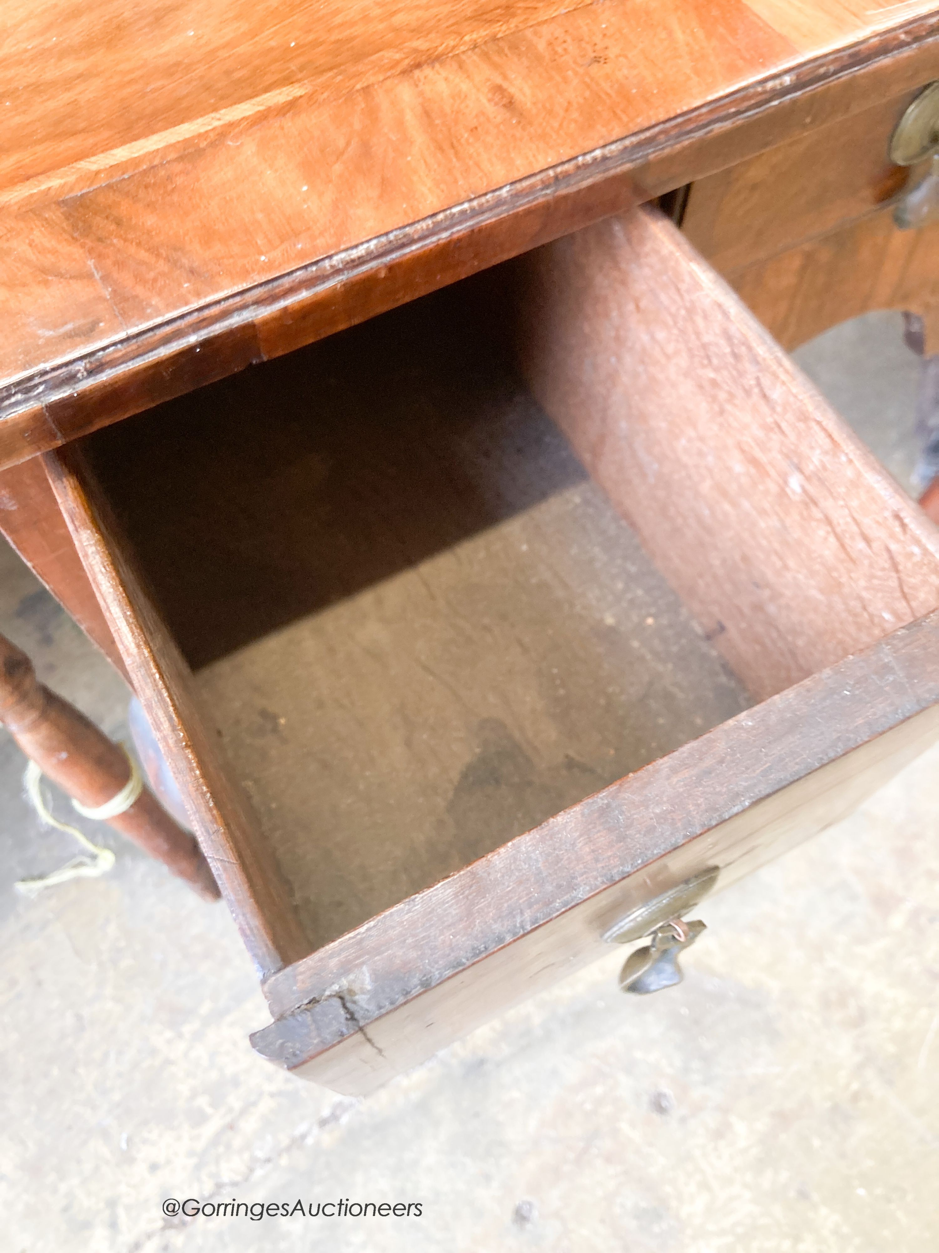 An early 18th century feather banded walnut three drawer lowboy, width 70cm, depth 48cm, height 70cm